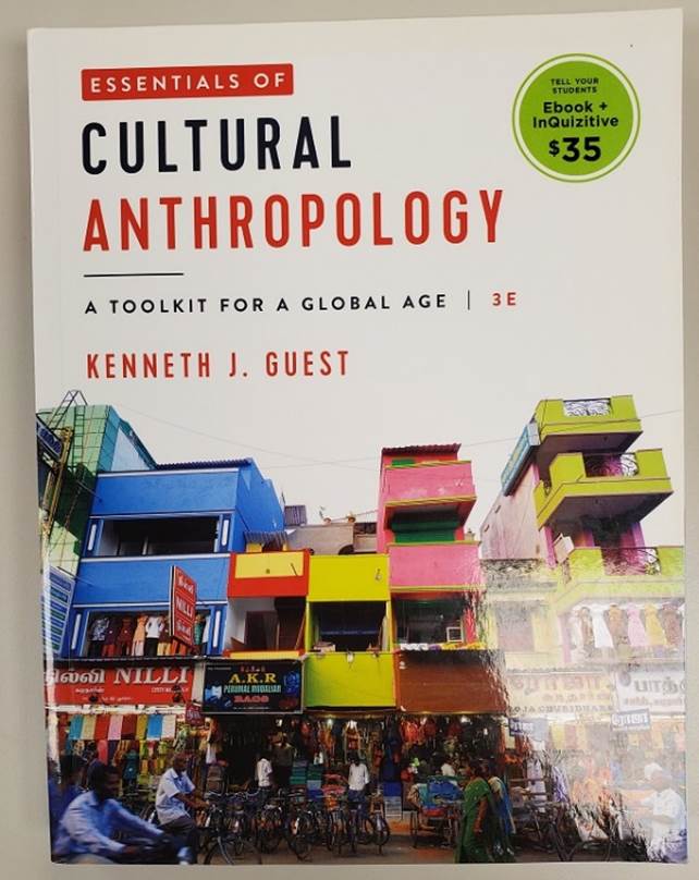 This image shows the cover of a book titled Essentials of Cultural Anthropology: A Toolkit for a Global Age by Kenneth J. Guest. The white cover has a photo of brightly colored buildings on a street in a city in Asia. The book was published by W. W. Norton and Company in 2020.